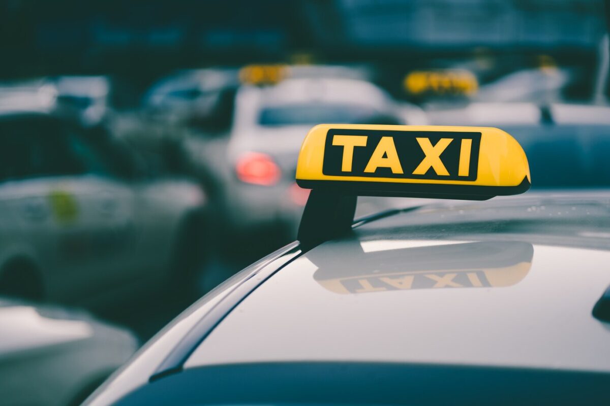 selective-focus-shot-yellow-taxi-sign-traffic-jam_181624-42635-e1744103852217